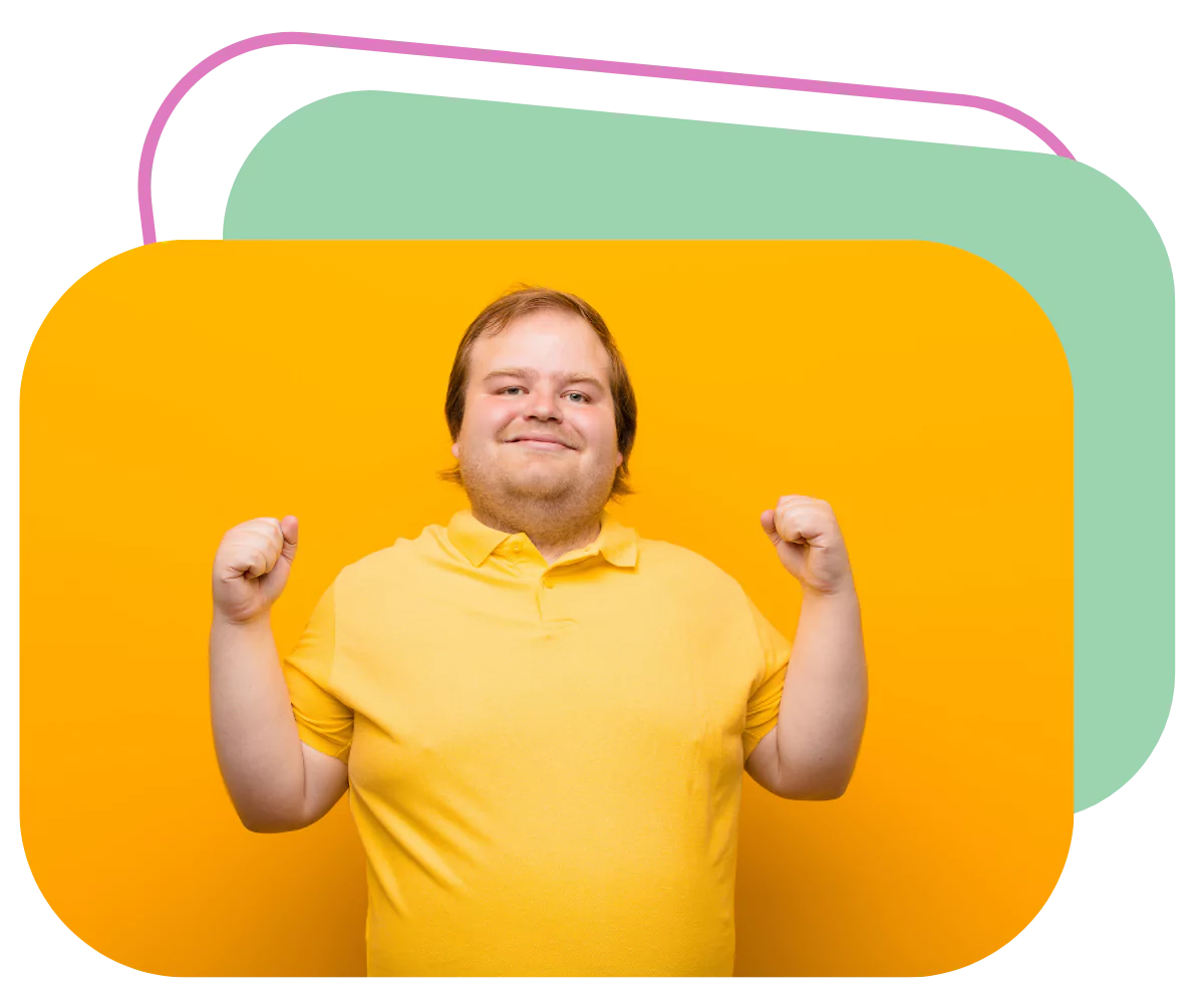 A disabled man is flexing his muscles for the camera. He's wearing a bright yellow shirt and is smiling